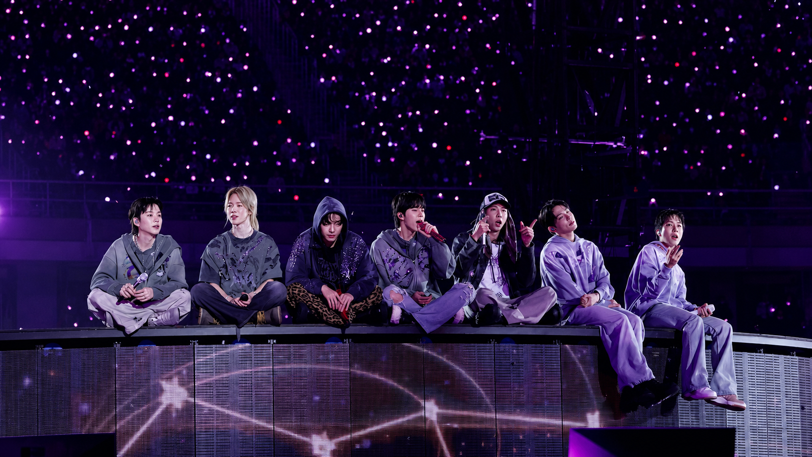 BTS concert lit by a sea of purple ARMY bombs
